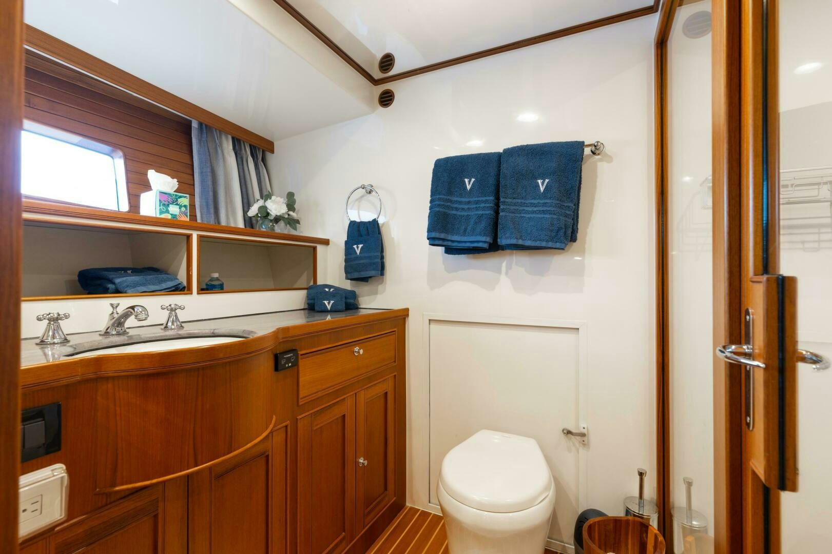 a bathroom with a toilet and a sink aboard VIRGINIA SEA Yacht for Sale
