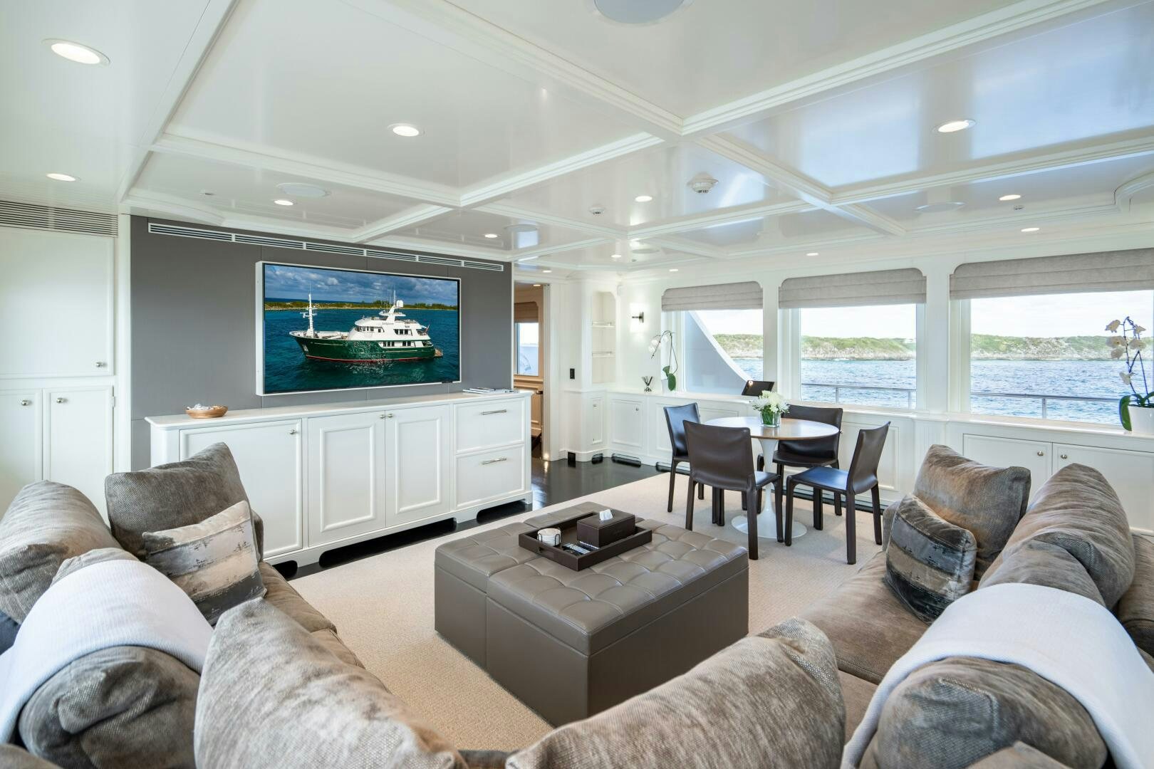 a living room with a large screen aboard ZEXPLORER Yacht for Sale