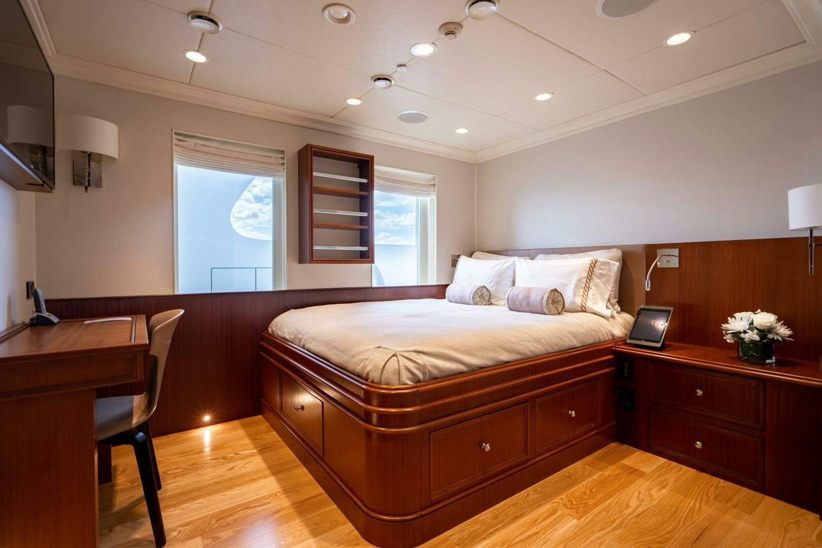 a bedroom with a bed and desk aboard ZEXPLORER Yacht for Sale