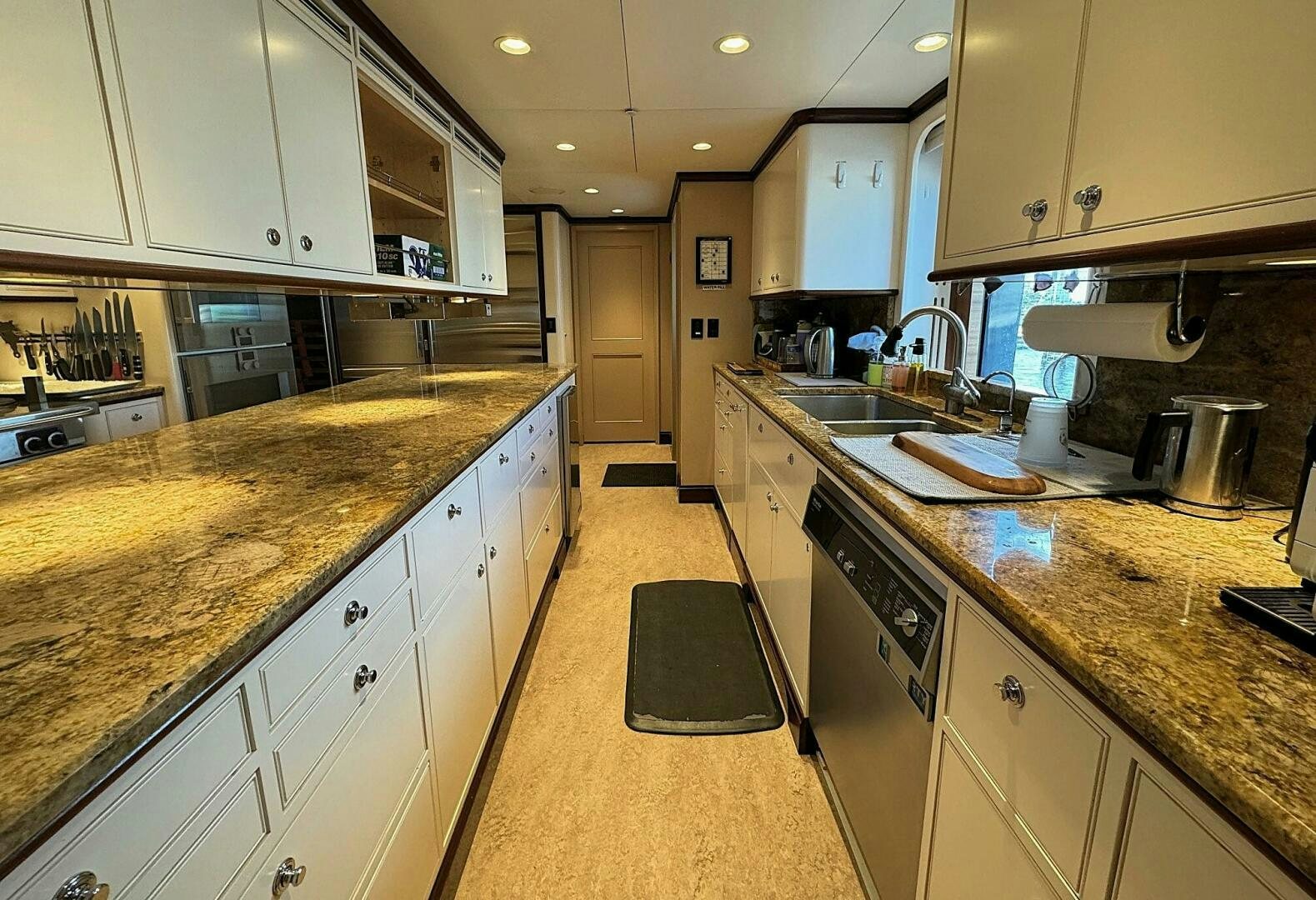 a kitchen with a countertop sink and cabinets aboard ZEXPLORER Yacht for Sale