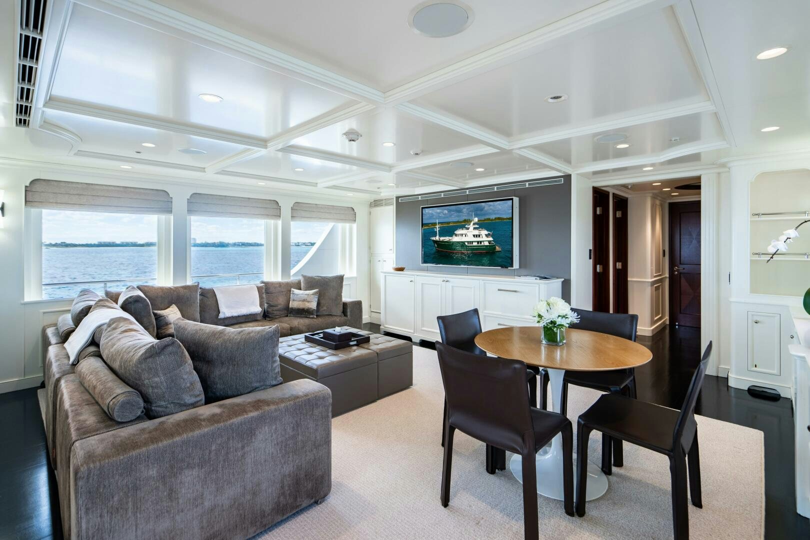 a living room with a couch and a table aboard ZEXPLORER Yacht for Sale