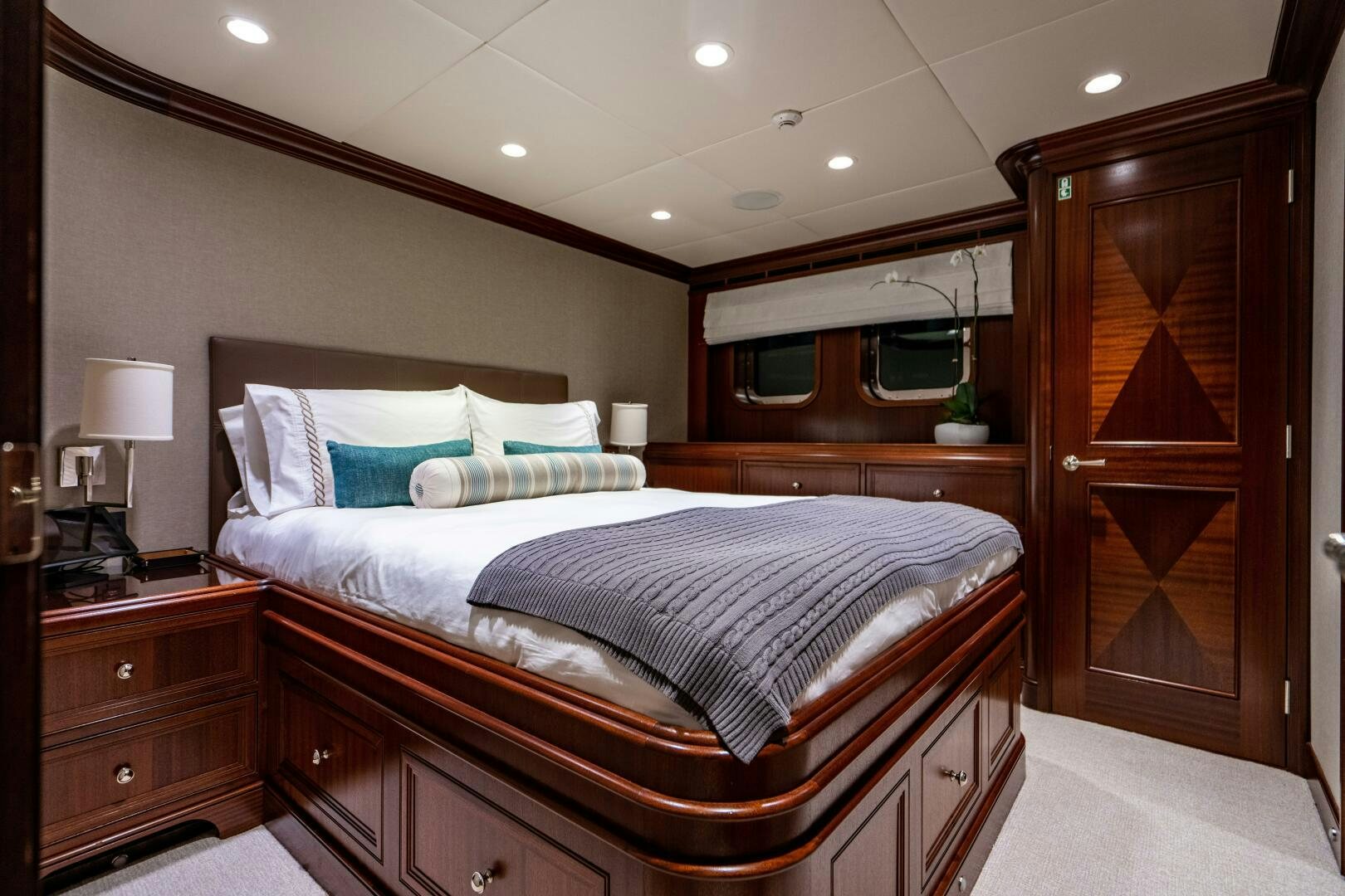 a bedroom with a bed and a desk aboard ZEXPLORER Yacht for Sale