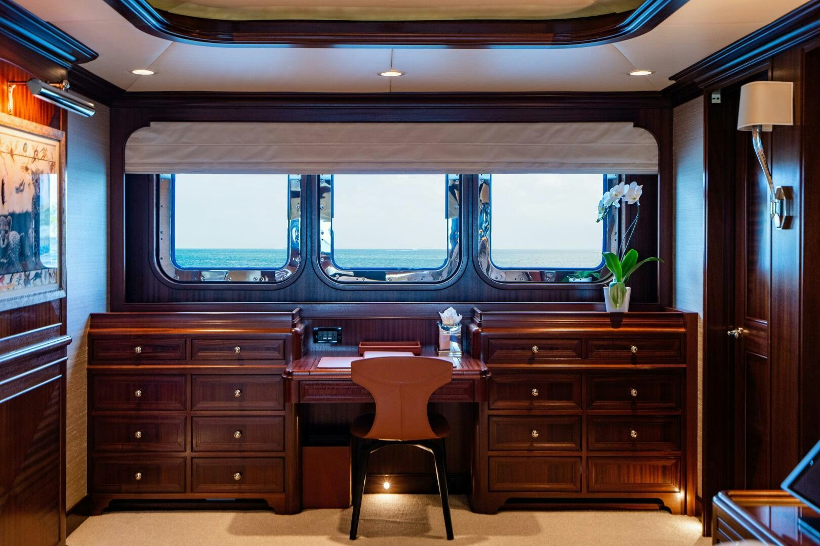 a room with a desk and a chair and a window aboard ZEXPLORER Yacht for Sale
