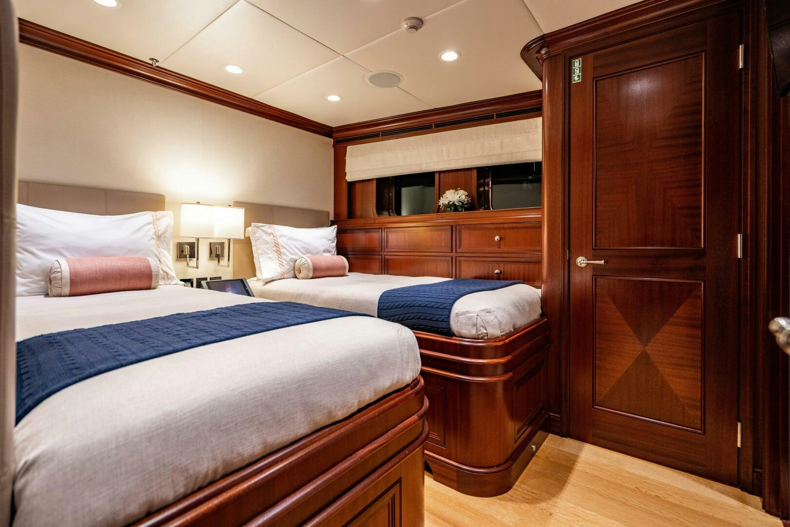 a room with a bed and a closet aboard ZEXPLORER Yacht for Sale