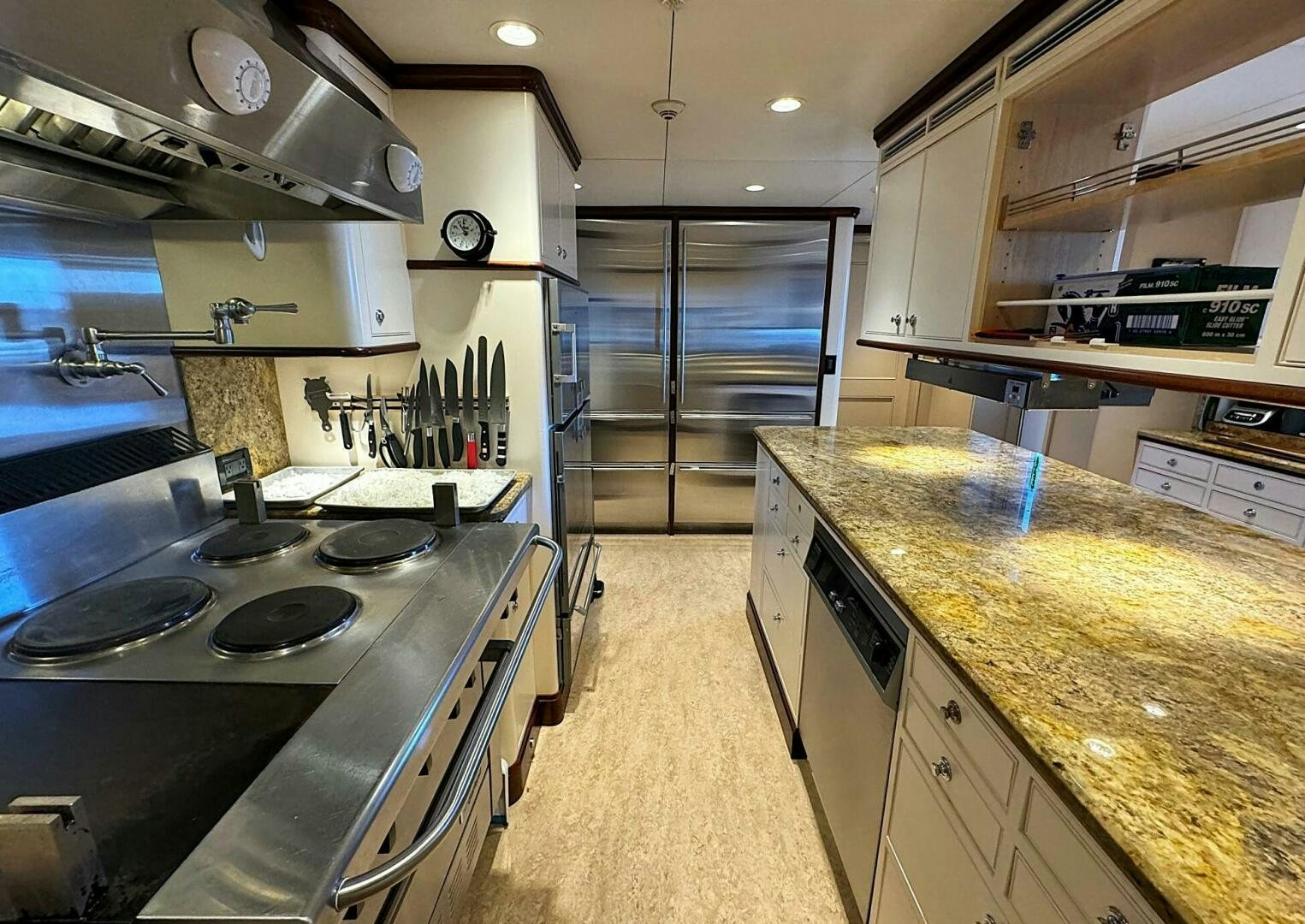 a kitchen with stainless steel appliances aboard ZEXPLORER Yacht for Sale