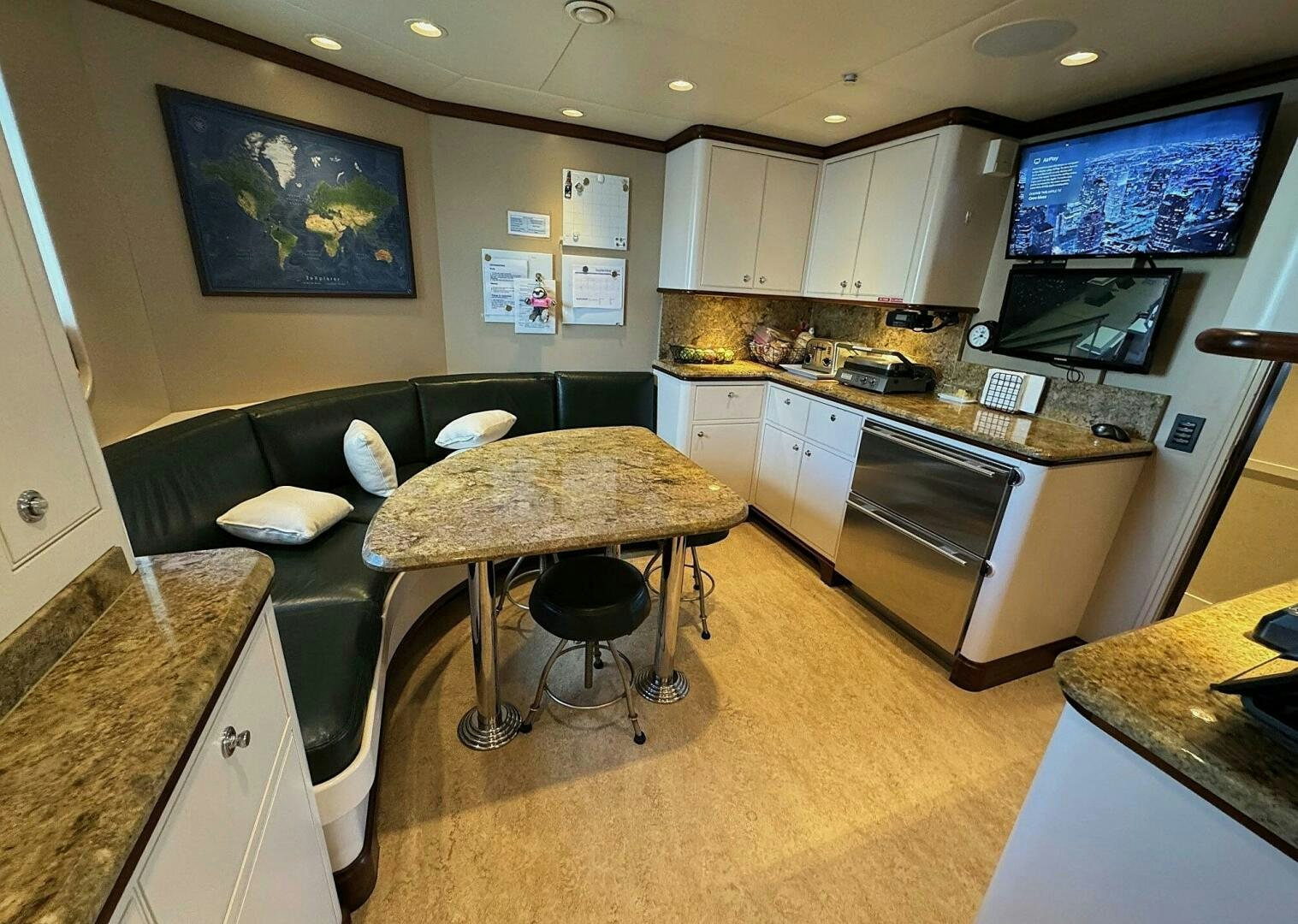 a kitchen with a couch and a table aboard ZEXPLORER Yacht for Sale