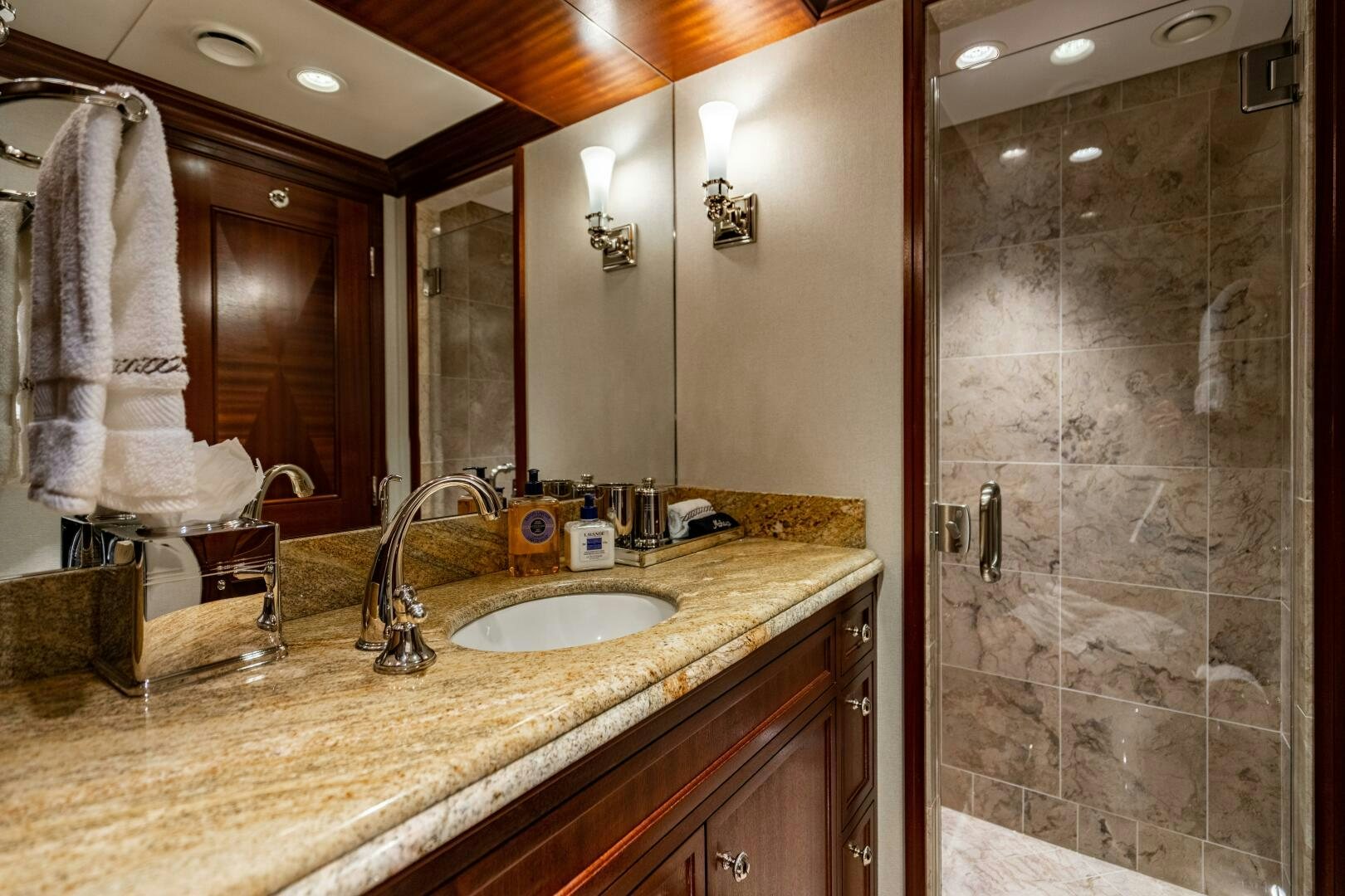a bathroom with a sink and a mirror aboard ZEXPLORER Yacht for Sale