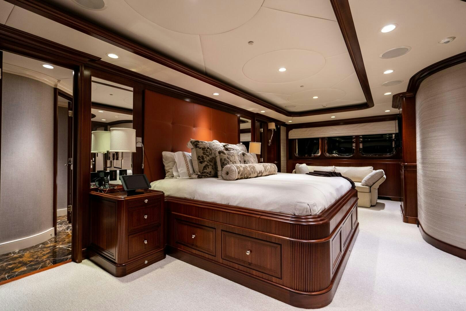 a bedroom with a bed and a desk aboard ZEXPLORER Yacht for Sale