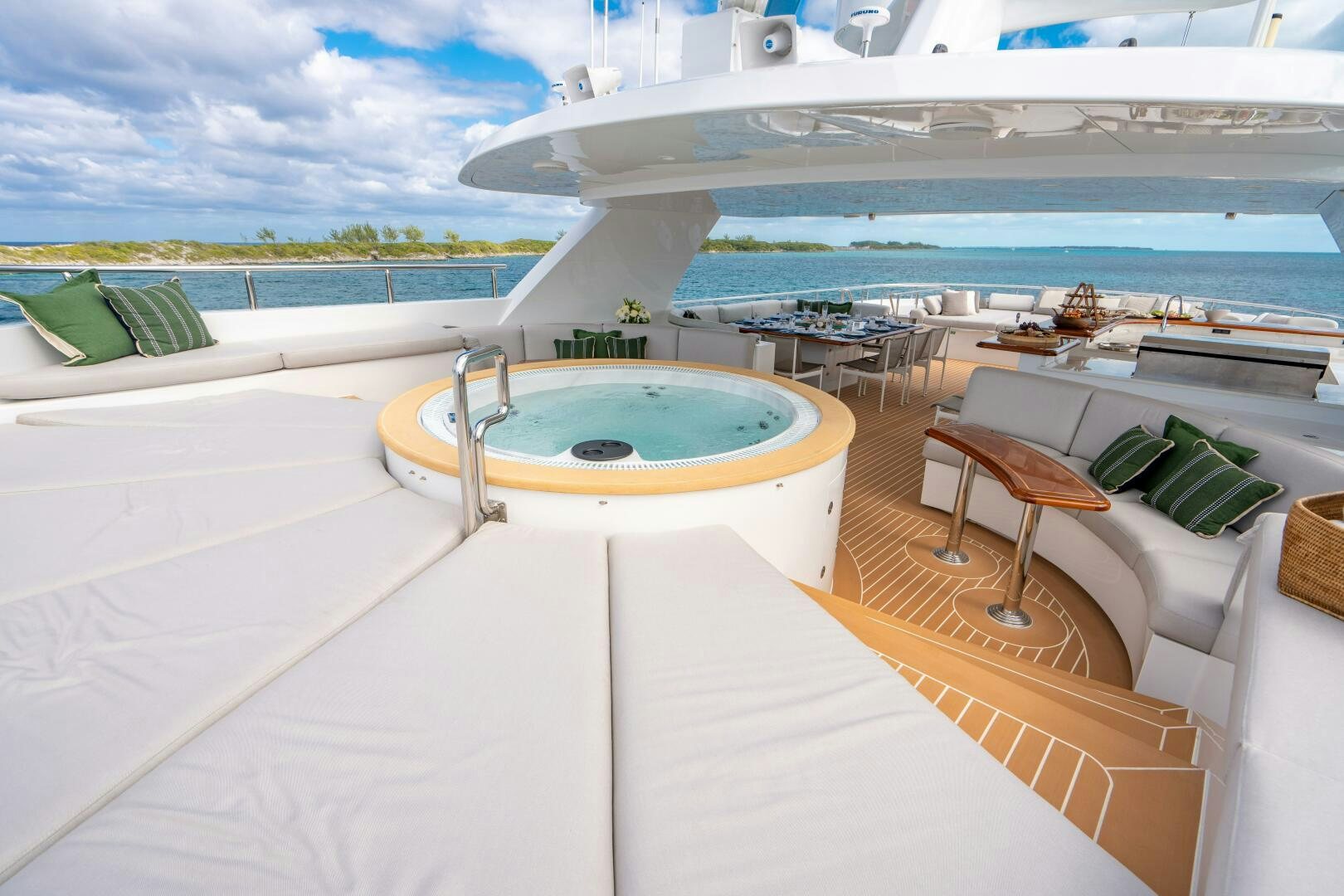 a pool with a table and chairs aboard ZEXPLORER Yacht for Sale
