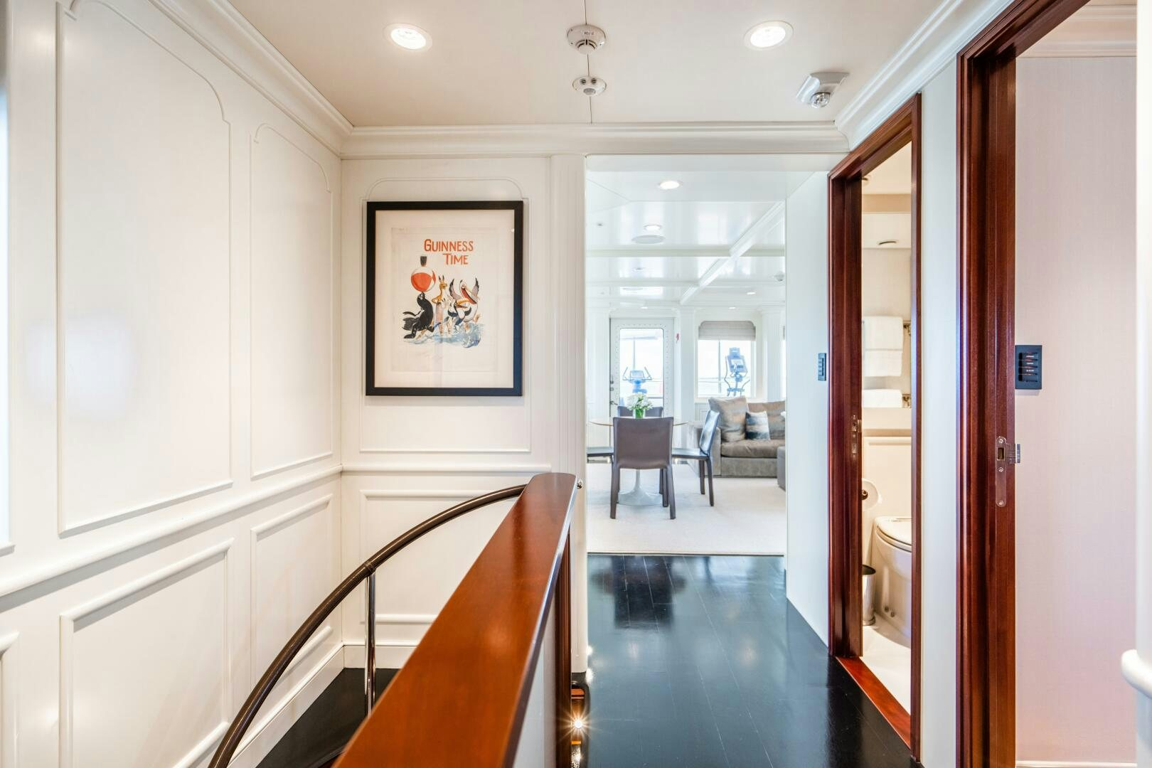 a hallway with a table and chairs aboard ZEXPLORER Yacht for Sale
