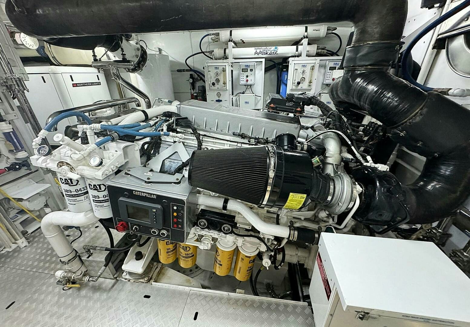 a car engine with a person standing under it aboard ZEXPLORER Yacht for Sale