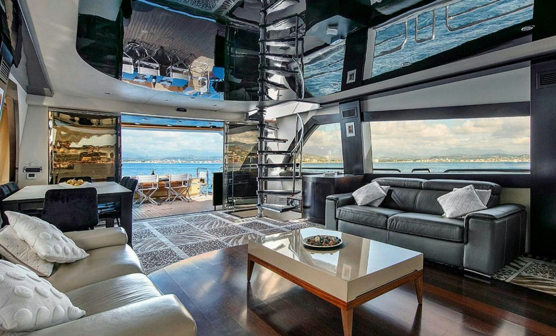 a living room with a large window aboard CLAREMONT Yacht for Sale