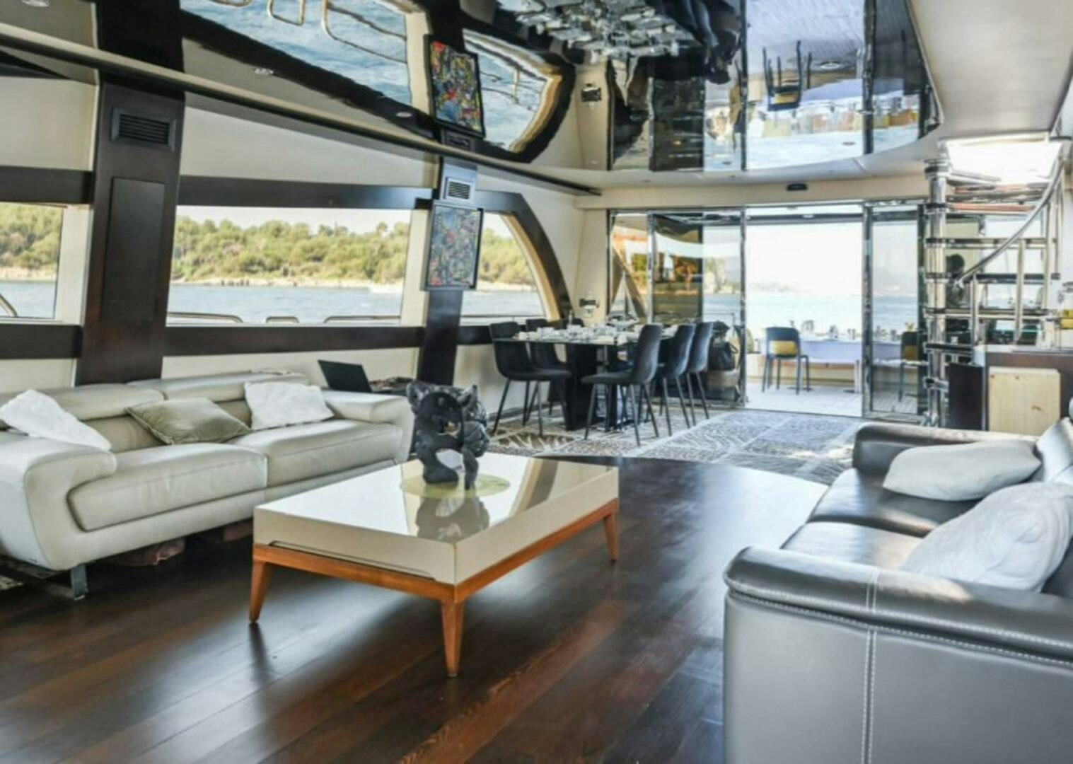 a living room with a cat statue aboard CLAREMONT Yacht for Sale