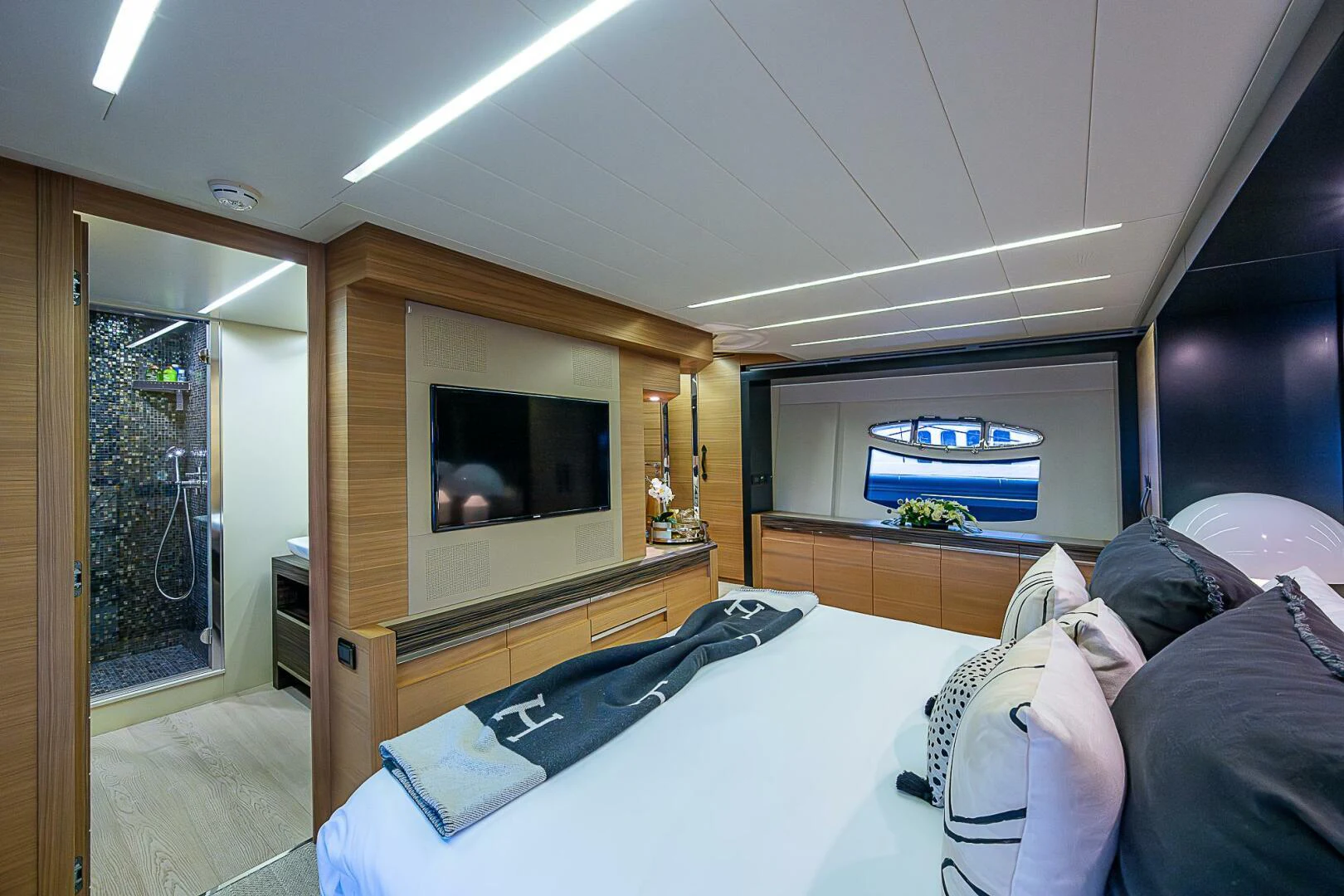 a bedroom with a tv and a bed aboard COAL BLOODED Yacht for Sale