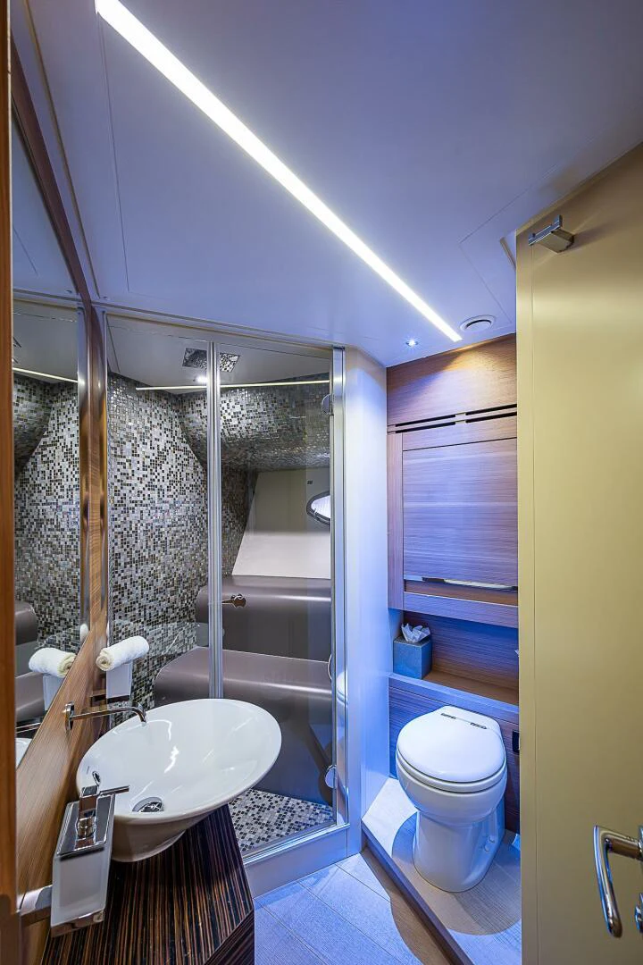 a bathroom with a glass shower aboard COAL BLOODED Yacht for Sale