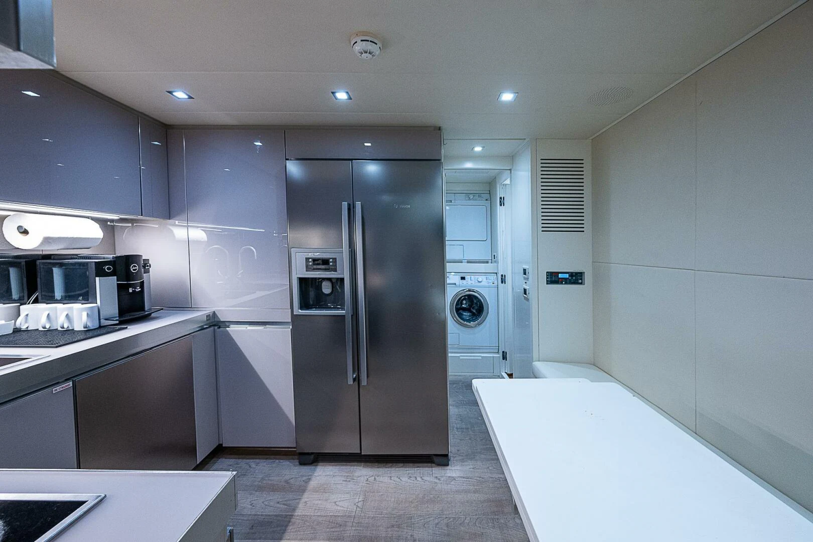 a kitchen with a refrigerator and stove aboard COAL BLOODED Yacht for Sale