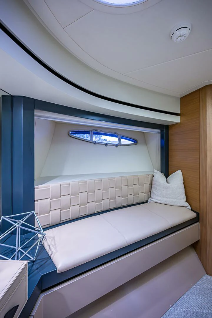 a bed with a white bed aboard COAL BLOODED Yacht for Sale