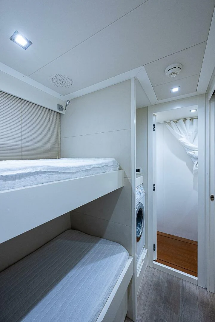 a room with a bed and a closet aboard COAL BLOODED Yacht for Sale