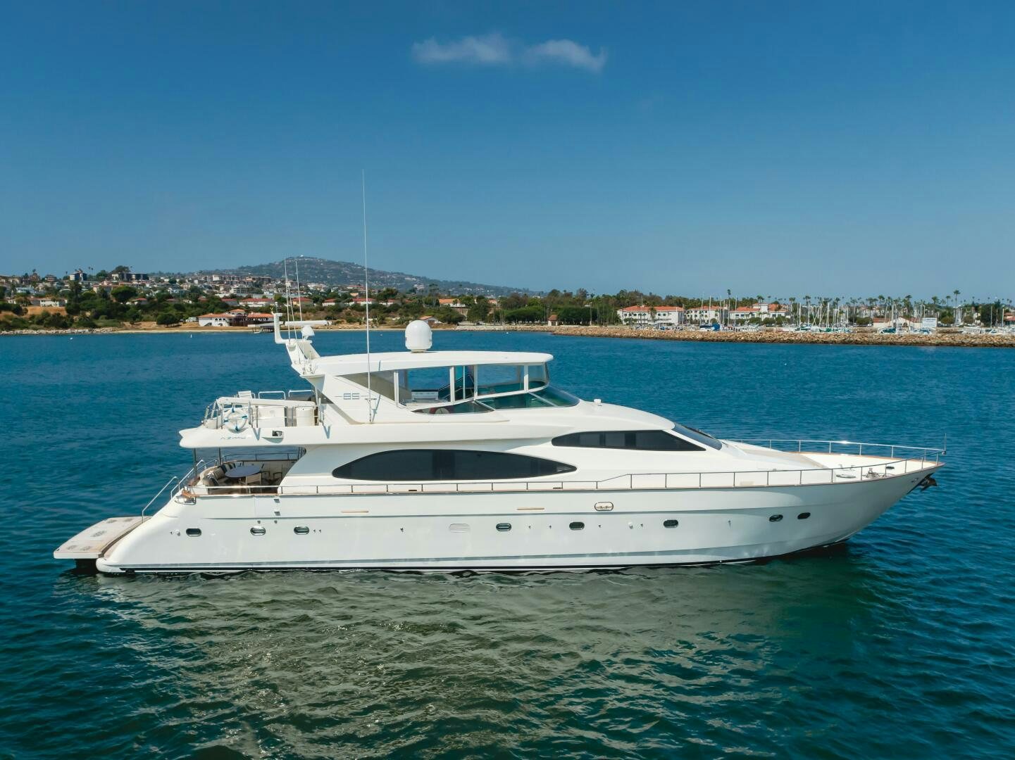 a white yacht in the water aboard ANEJO Yacht for Sale