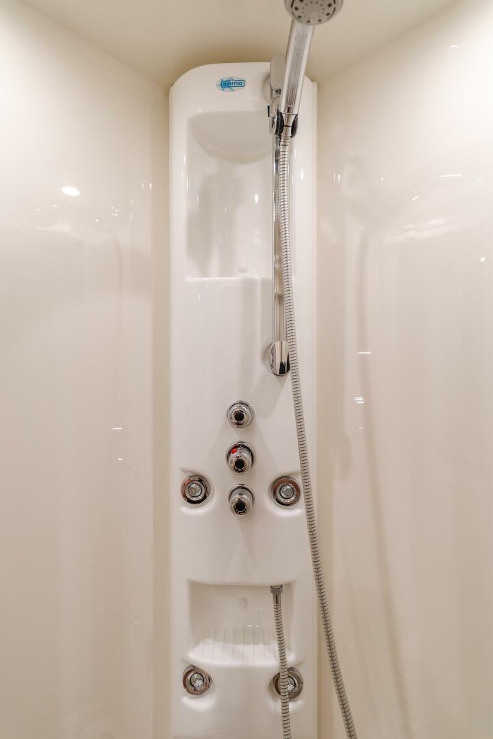 a shower head with water running down the side aboard ANEJO Yacht for Sale