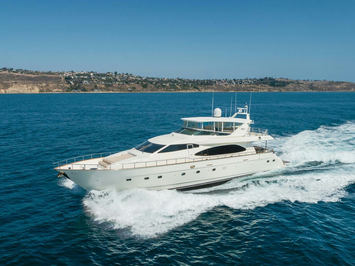 a white yacht on the water aboard ANEJO Yacht for Sale