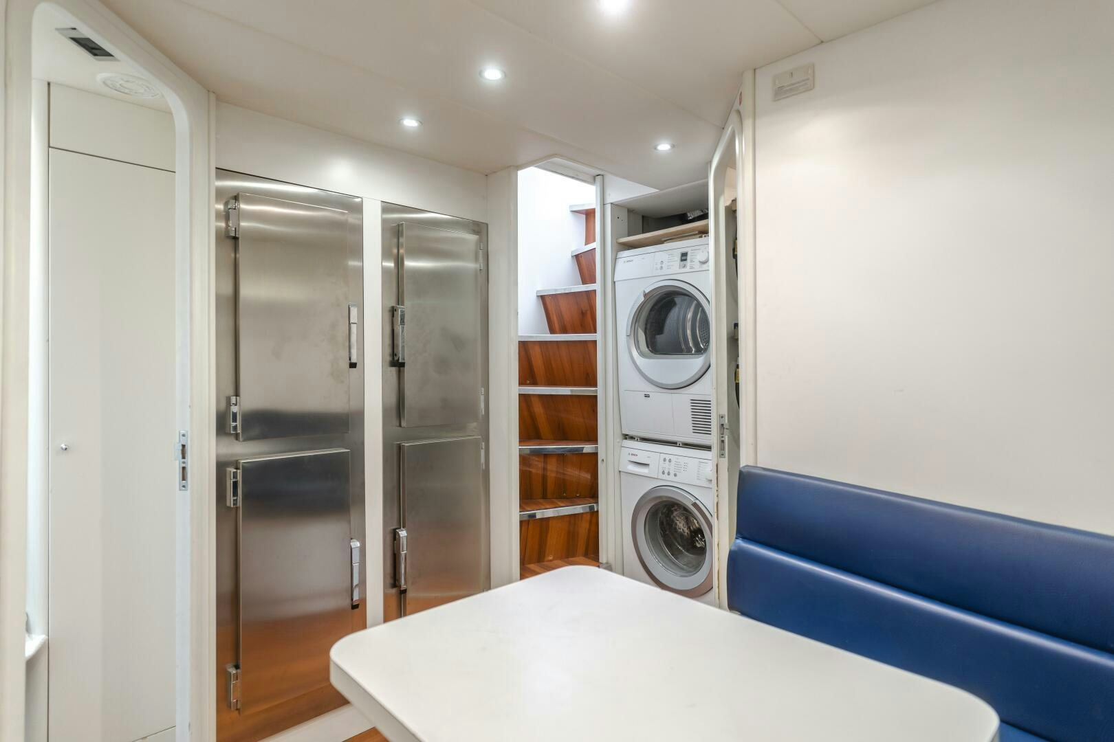 a room with a washing machine and a closet aboard ANEJO Yacht for Sale