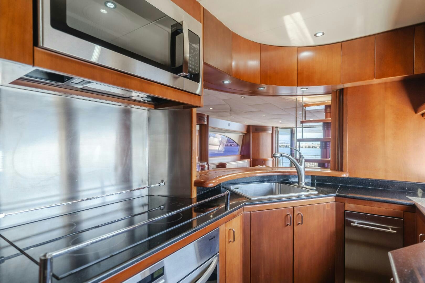 a kitchen with a stainless steel oven aboard ANEJO Yacht for Sale
