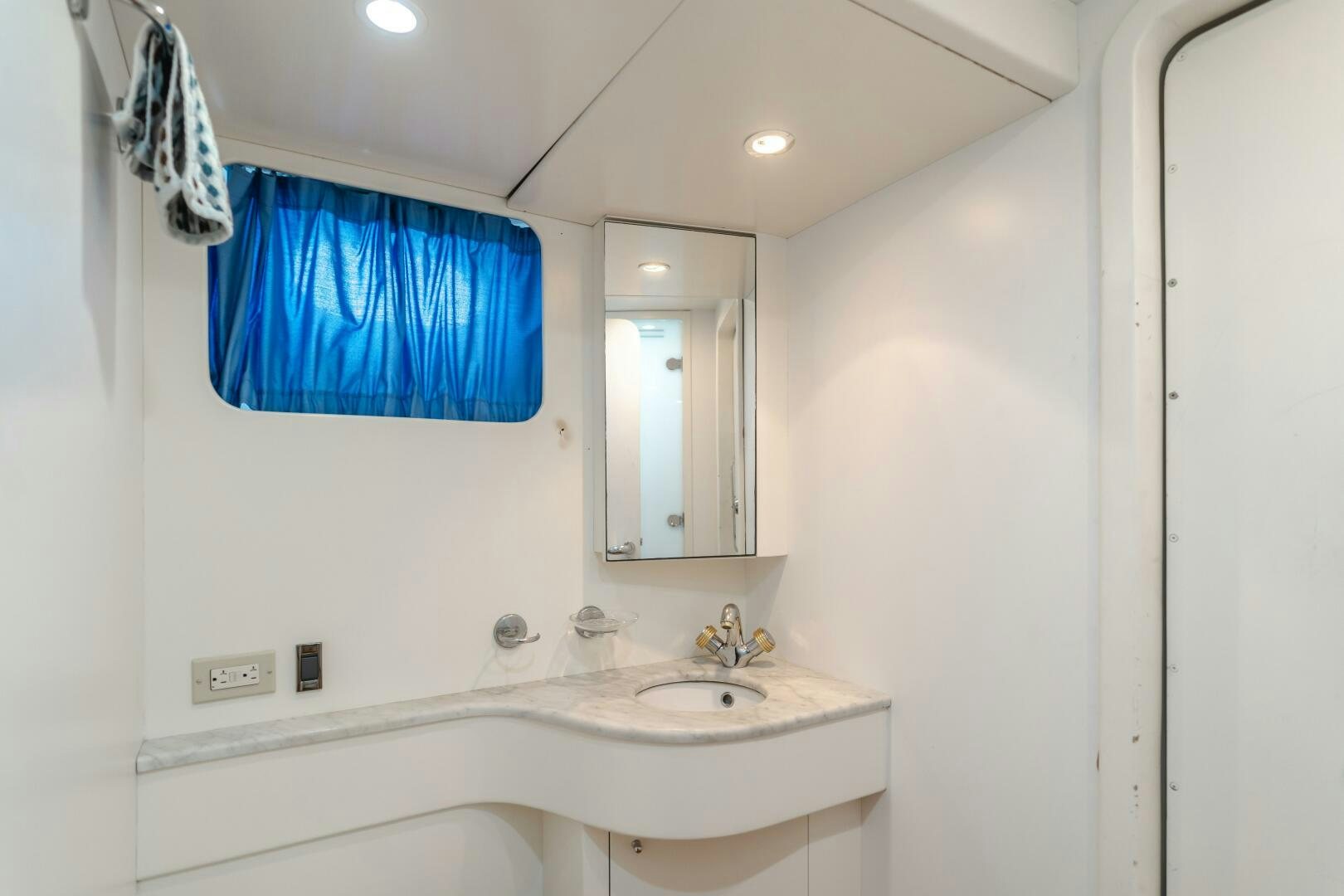a bathroom with a sink and a mirror aboard ANEJO Yacht for Sale