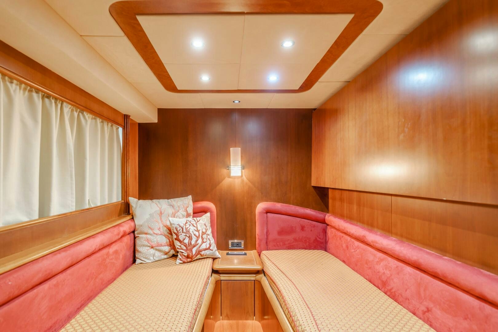 a room with a bed and a lamp aboard ANEJO Yacht for Sale