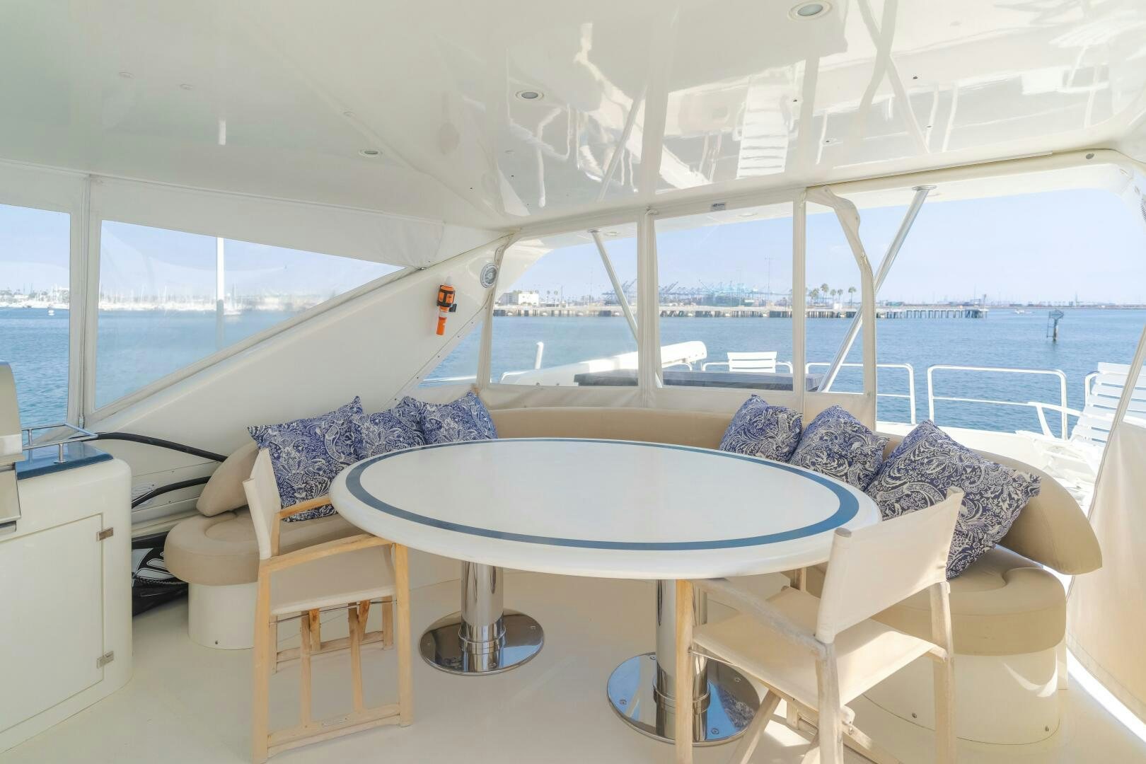 a room with a table and chairs aboard ANEJO Yacht for Sale