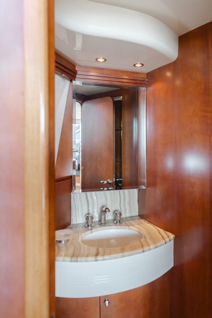 a bathroom with a large mirror aboard ANEJO Yacht for Sale