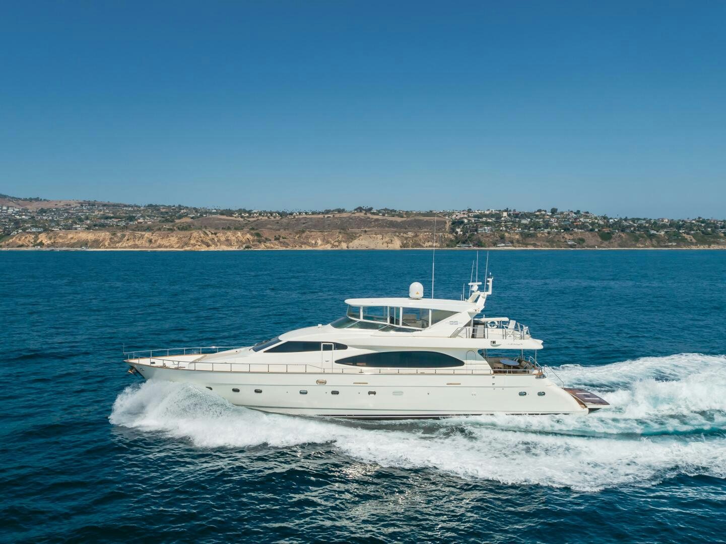 a white yacht on the water aboard ANEJO Yacht for Sale