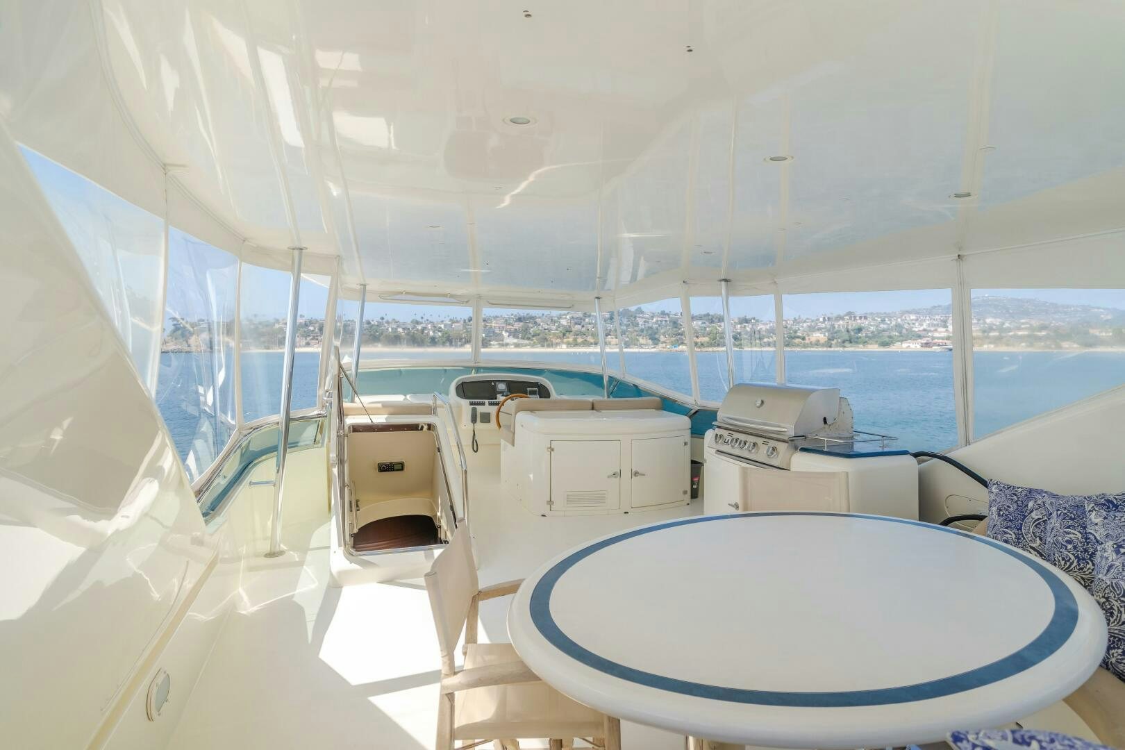 a room with a table and chairs aboard ANEJO Yacht for Sale