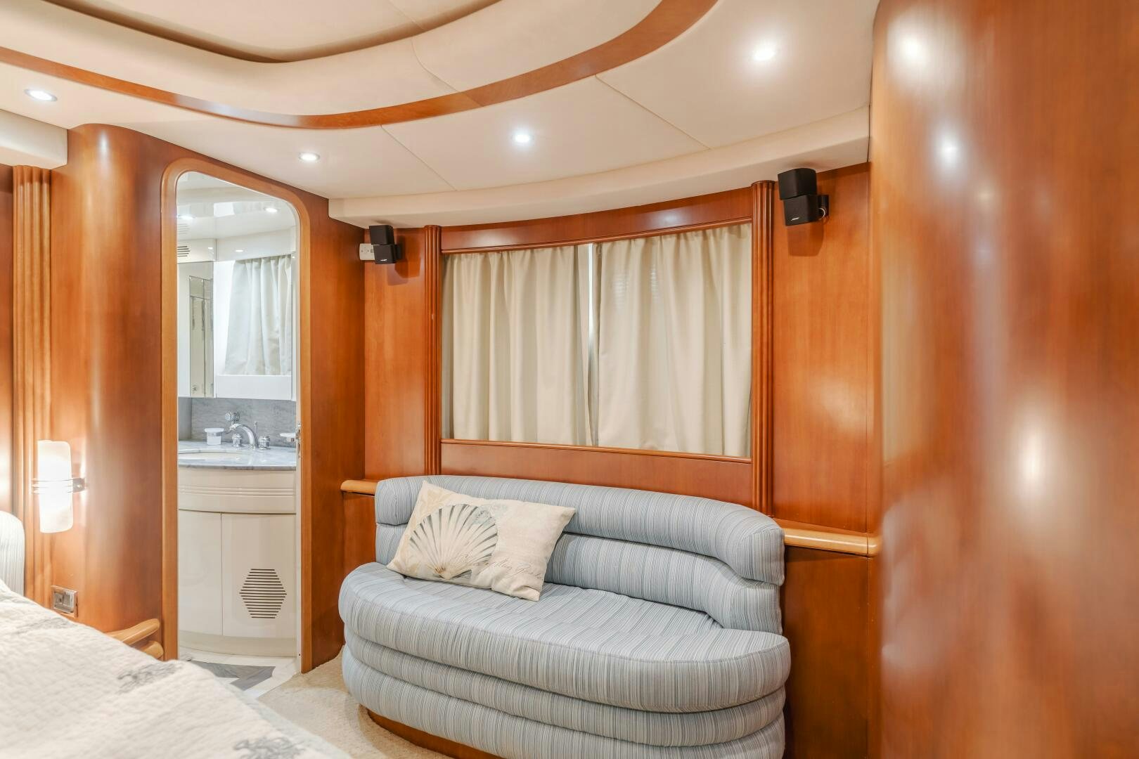 a bed and a couch in a room aboard ANEJO Yacht for Sale