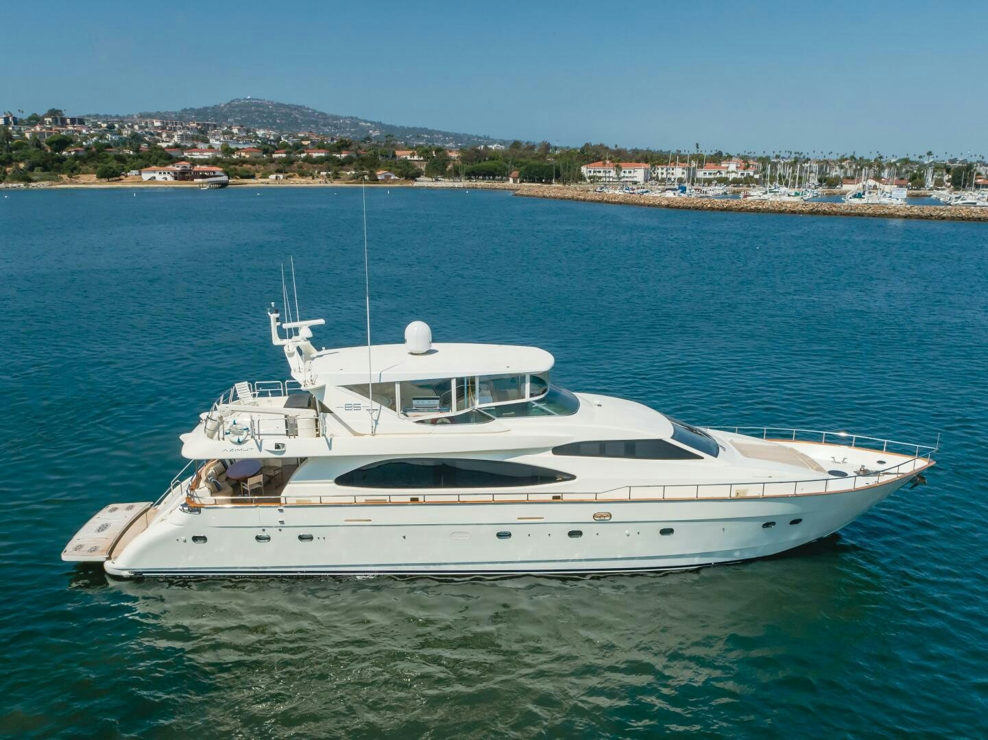 a white yacht in the water aboard ANEJO Yacht for Sale
