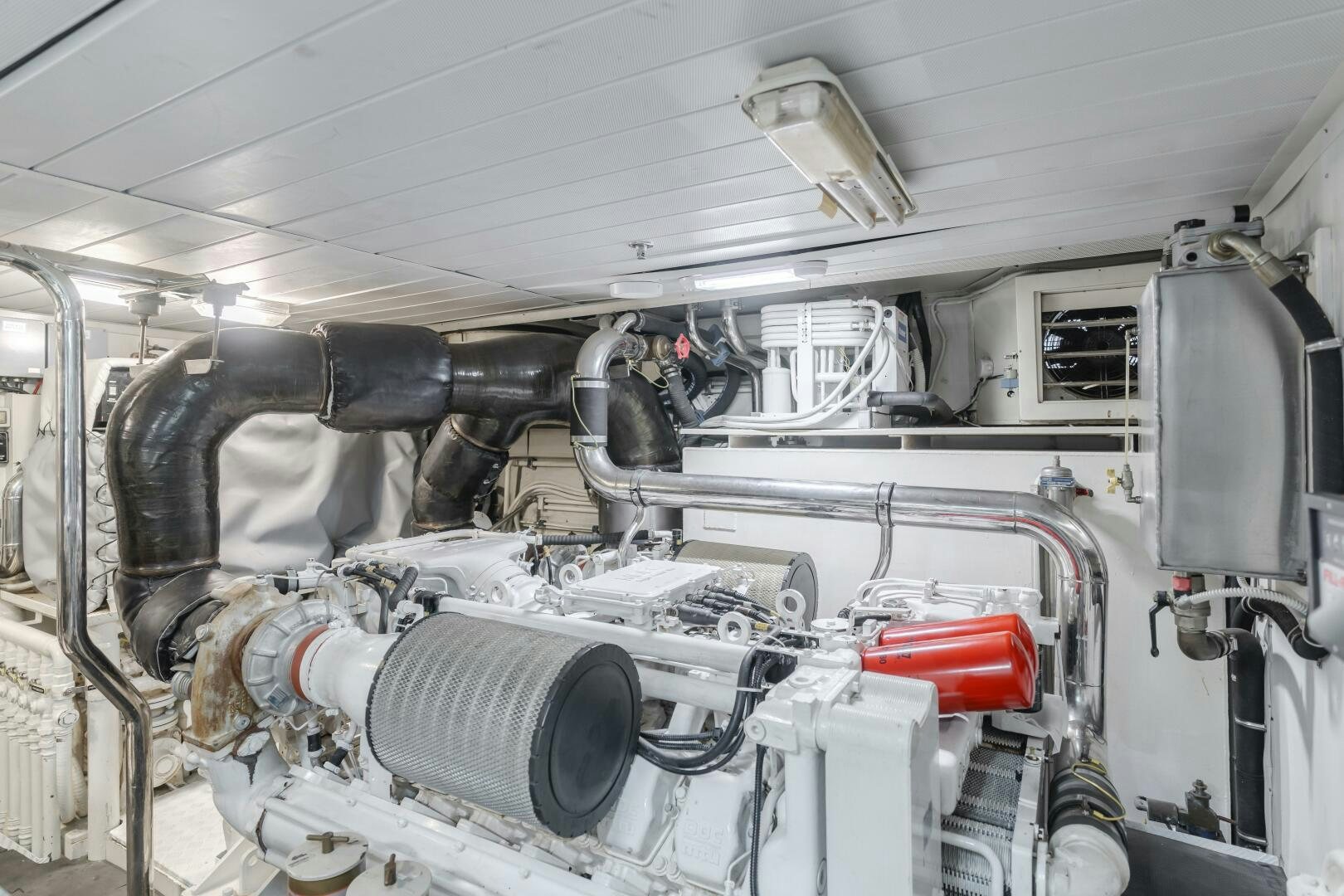 a car with a large engine aboard ANEJO Yacht for Sale