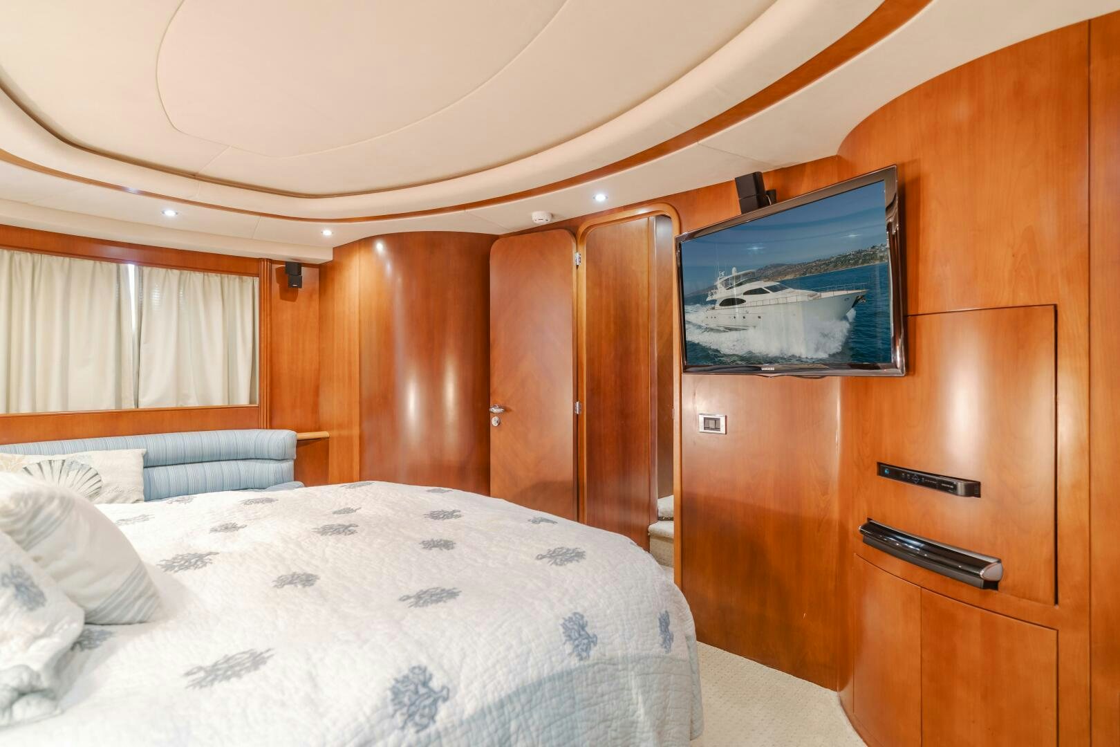 a bed with a television on it aboard ANEJO Yacht for Sale