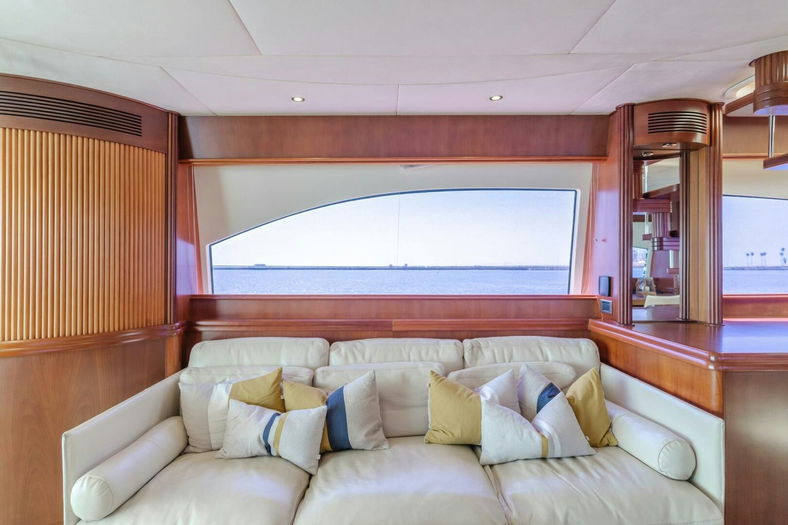a large white couch in a room aboard ANEJO Yacht for Sale