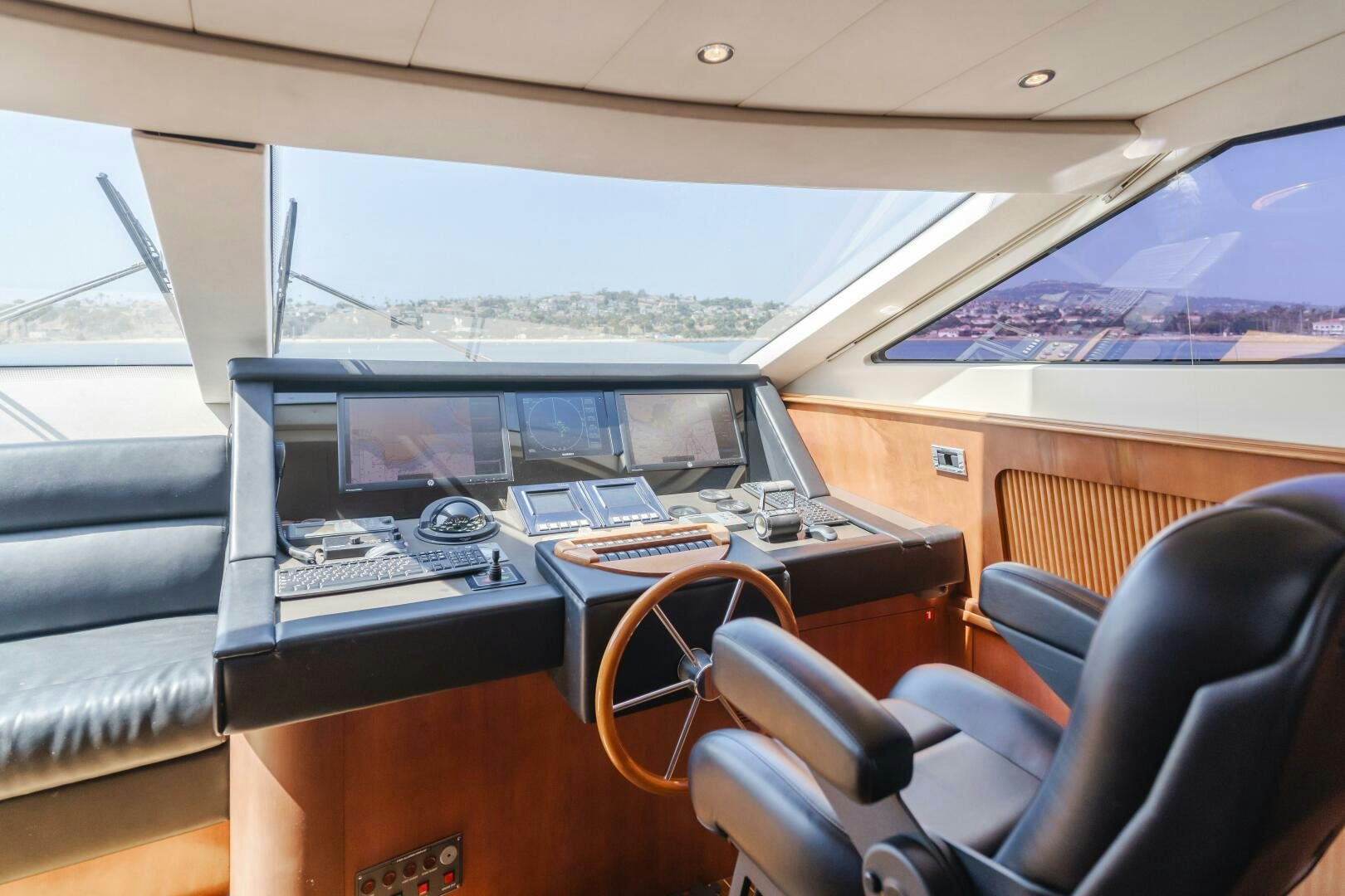 inside of a vehicle with a desk and chairs and a large window aboard ANEJO Yacht for Sale