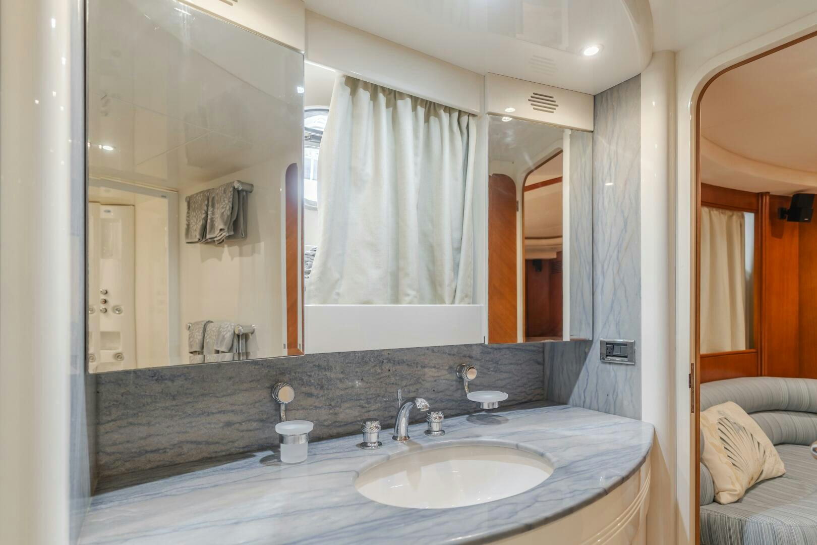 a bathroom with a large mirror aboard ANEJO Yacht for Sale
