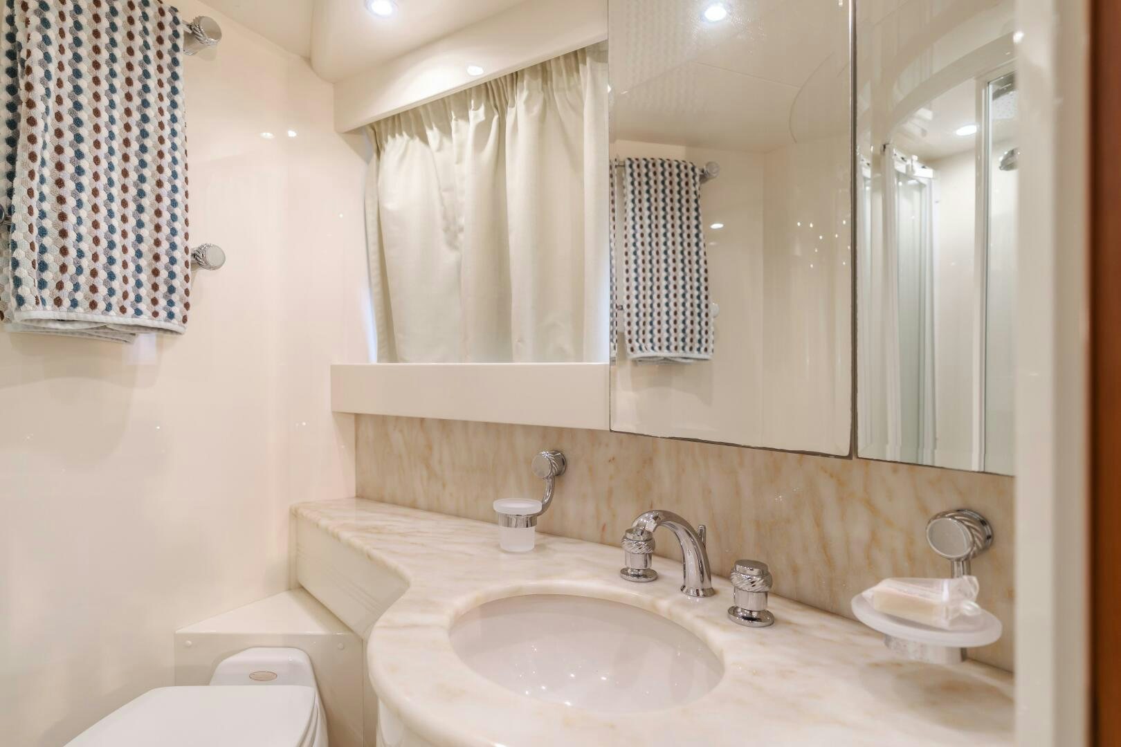 a bathroom with a sink and toilet aboard ANEJO Yacht for Sale