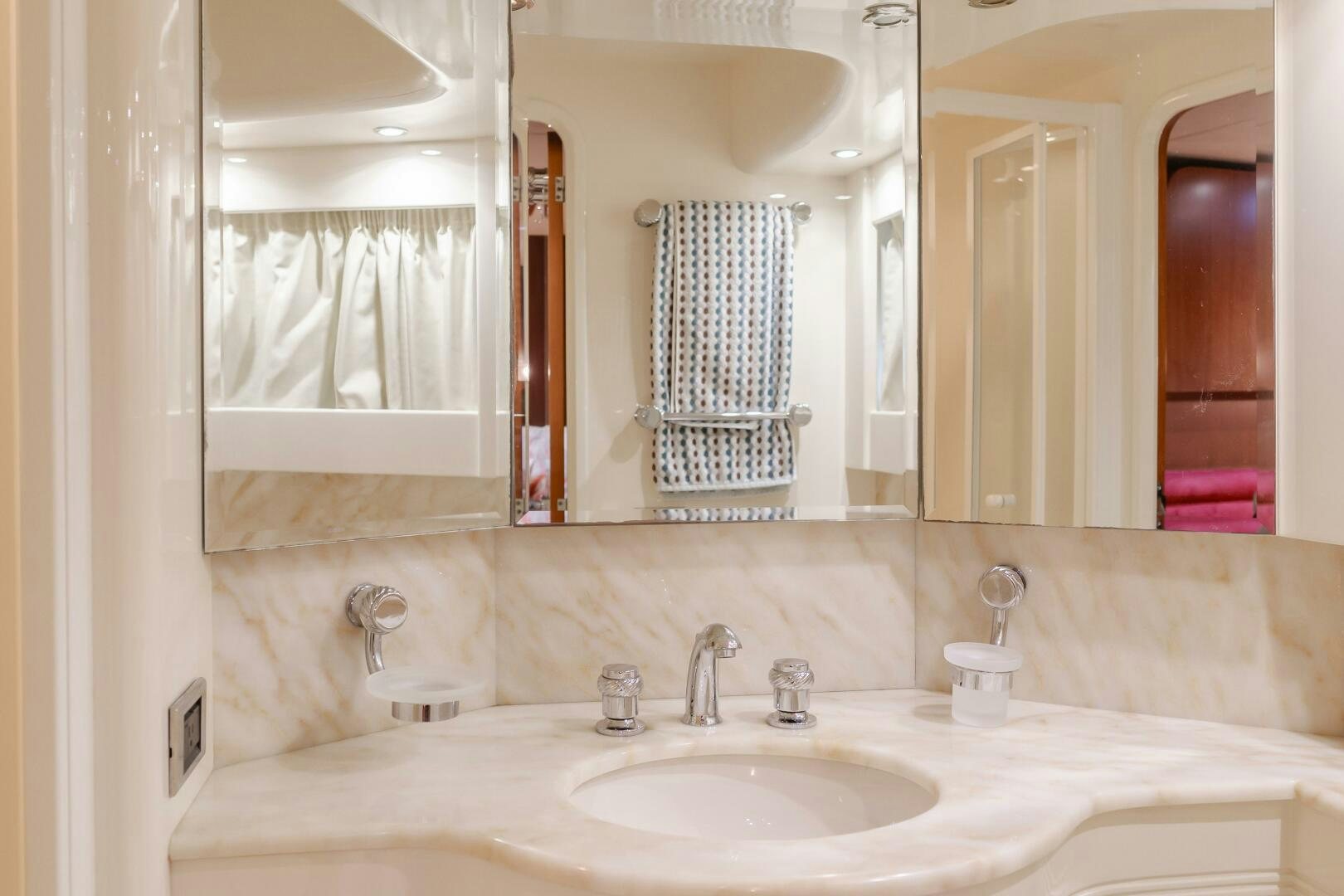 a bathroom with a sink and a mirror aboard ANEJO Yacht for Sale