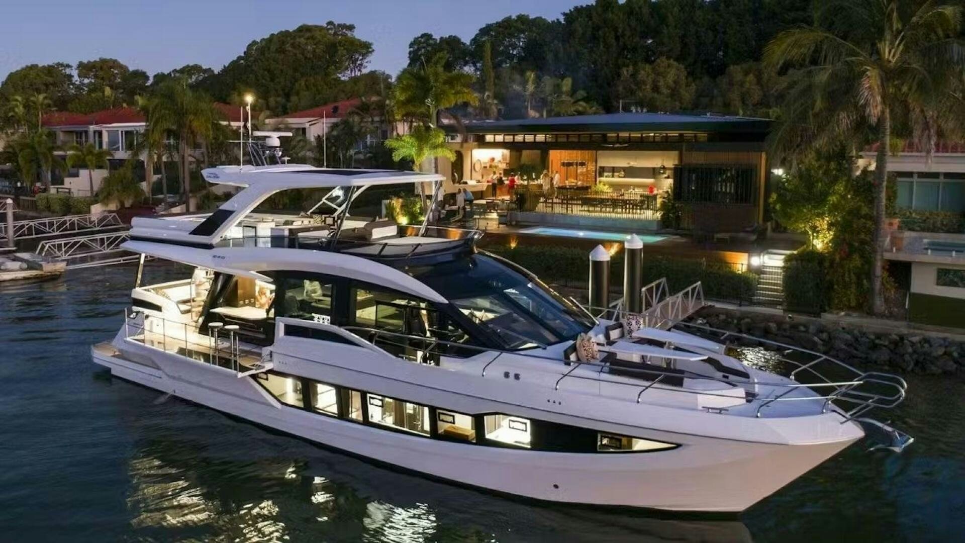 a boat docked at a pier aboard TRIPLE T Yacht for Sale
