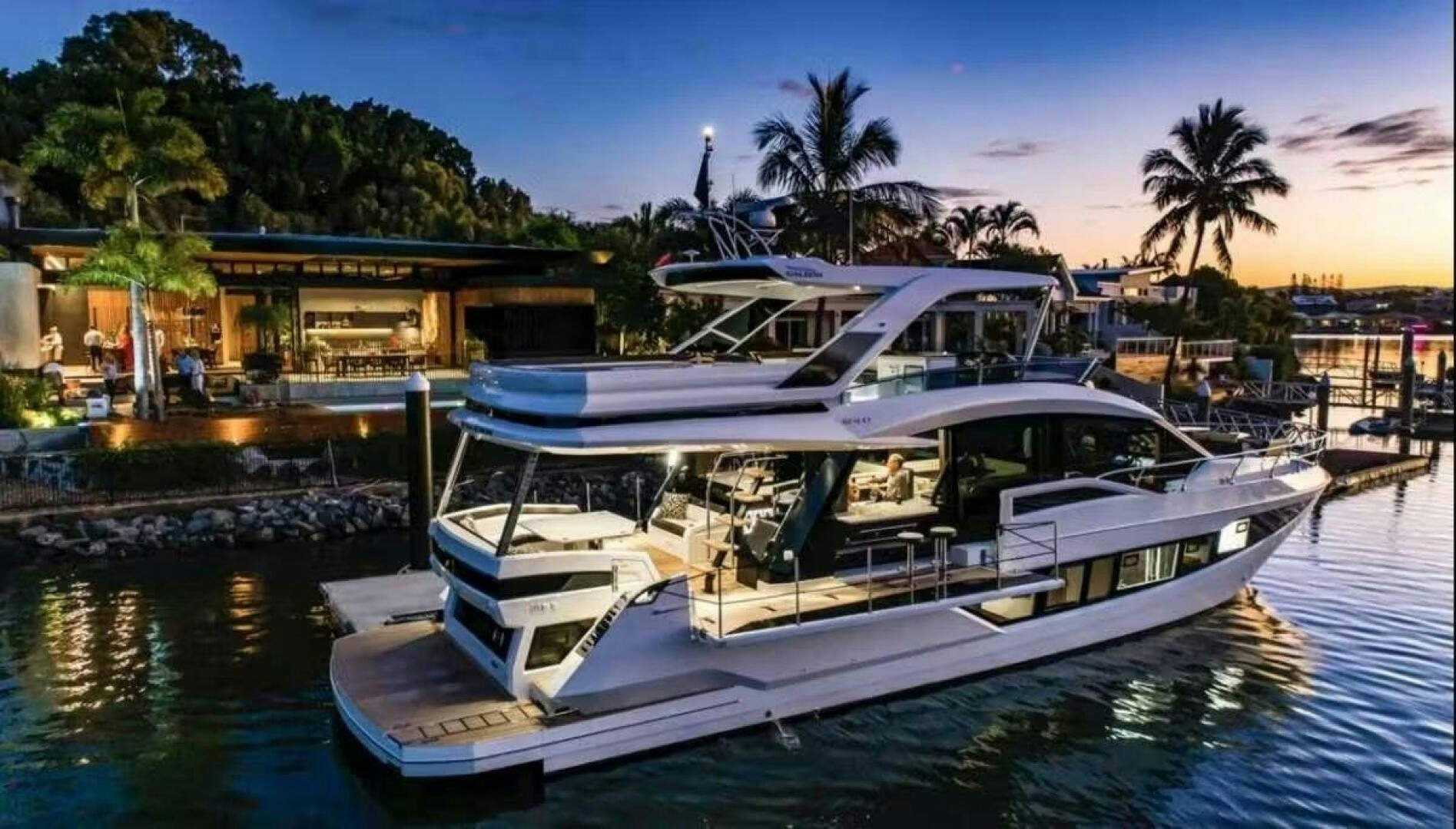 a boat docked at a pier aboard TRIPLE T Yacht for Sale