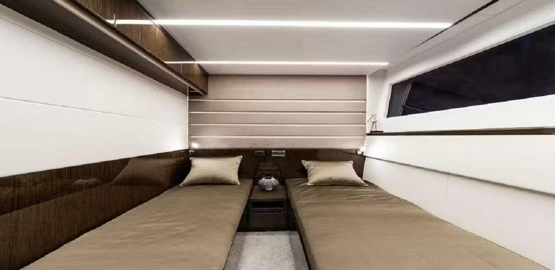 a room with two beds aboard TRIPLE T Yacht for Sale