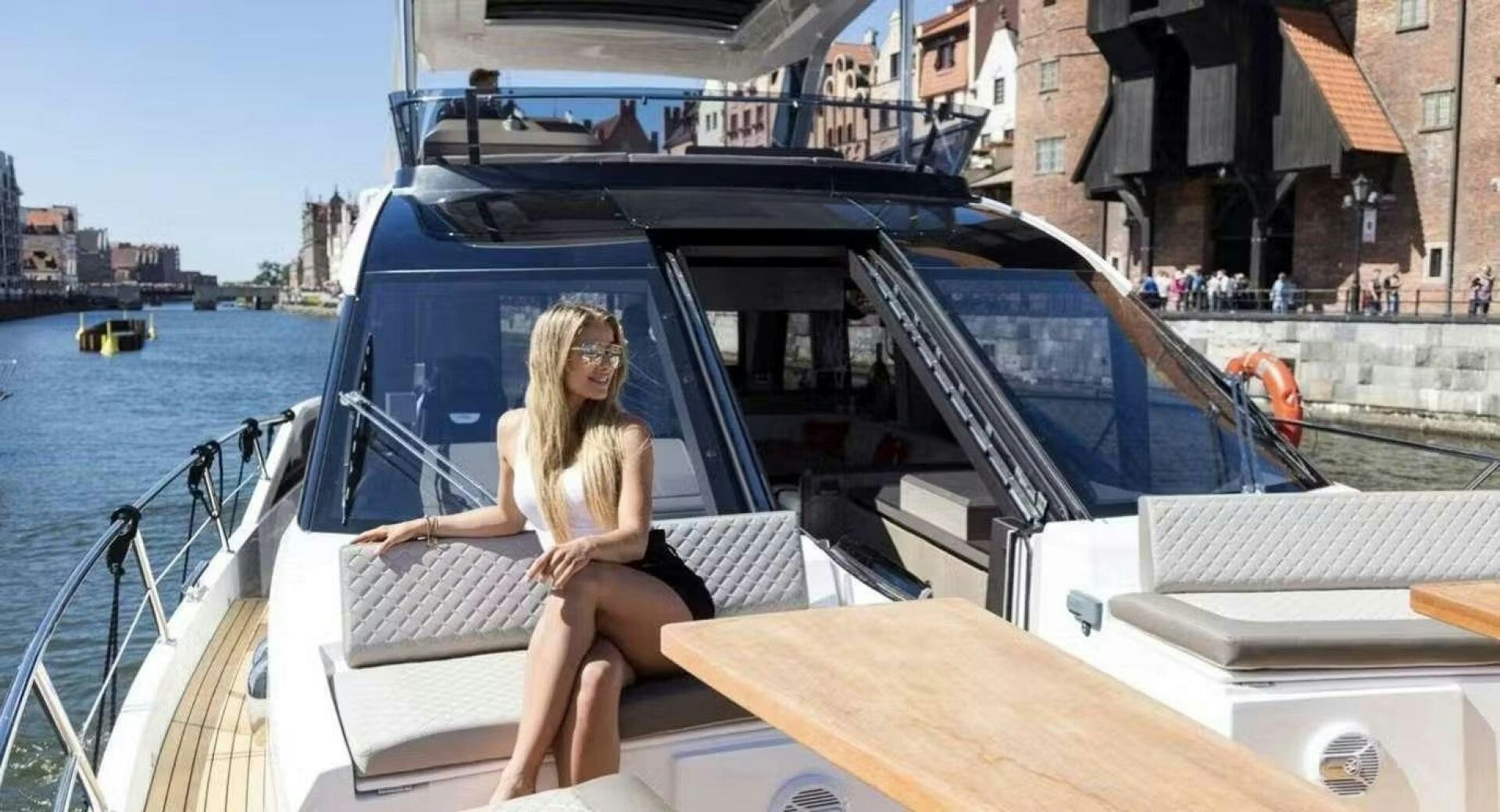 a person sitting on a boat aboard TRIPLE T Yacht for Sale
