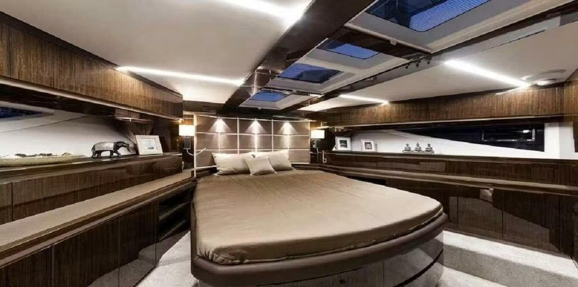 a room with a bed and a desk aboard TRIPLE T Yacht for Sale