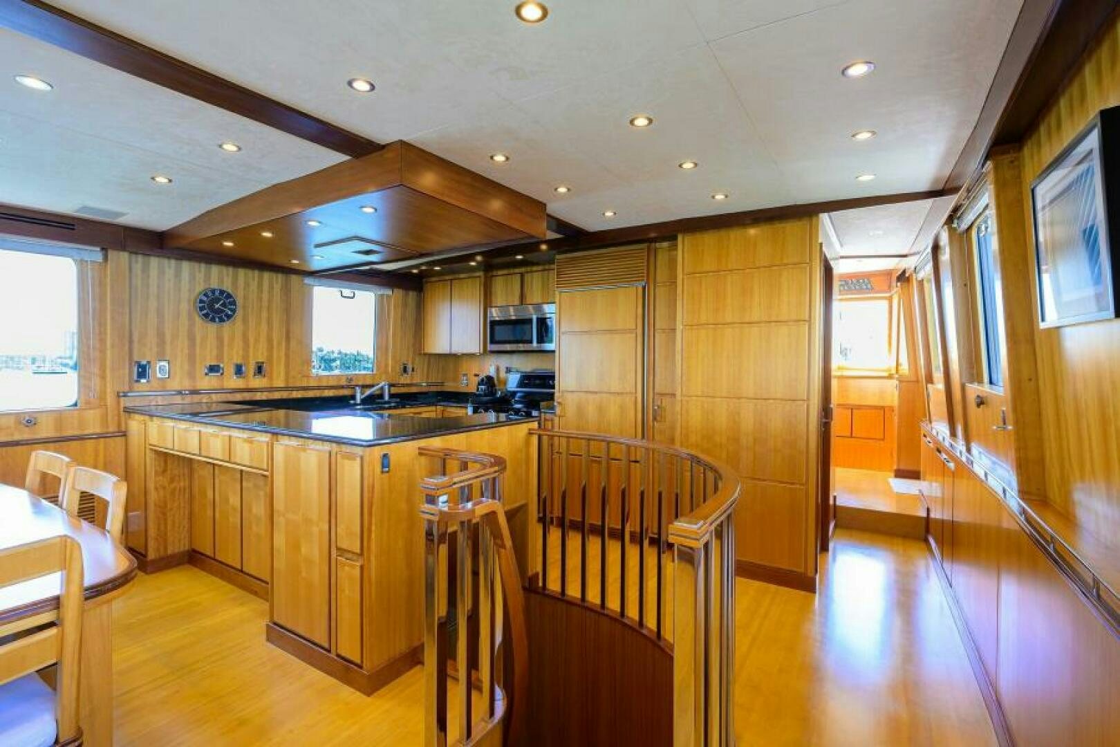 a kitchen with wooden cabinets aboard ELECTRA Yacht for Sale