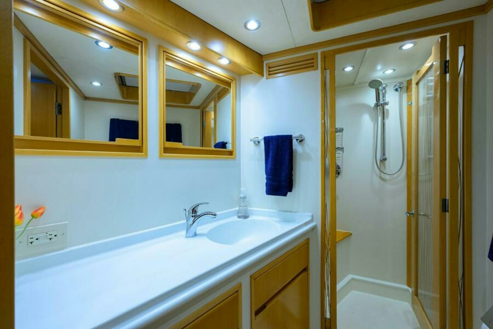 a bathroom with a large mirror aboard ELECTRA Yacht for Sale