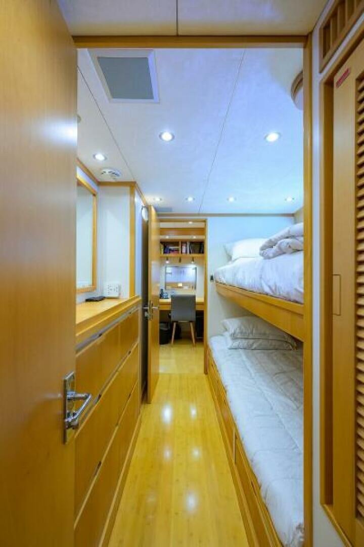 a room with a bed and a mirror aboard ELECTRA Yacht for Sale